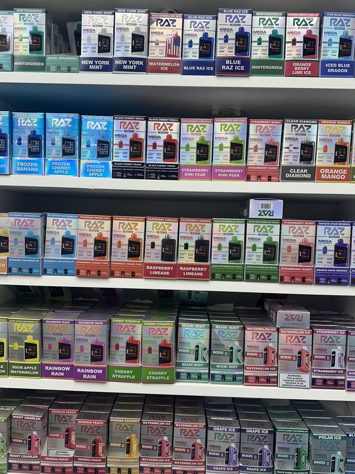 The disposables wall at Golden Vape & Smoke – Premium Cigar in Golden